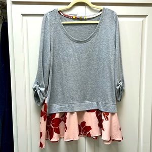 Light sweater with down in flowy blouse